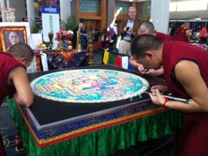 Buddhist monks creating peace mandala